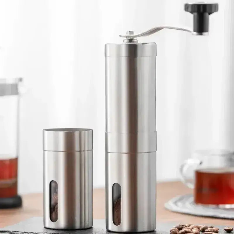 Manual coffee grinder set made of stainless steel with a container for beans, ideal for home kitchen and outdoor use.